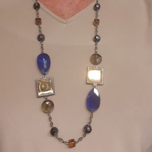 Blues, golds. Very pretty long necklace